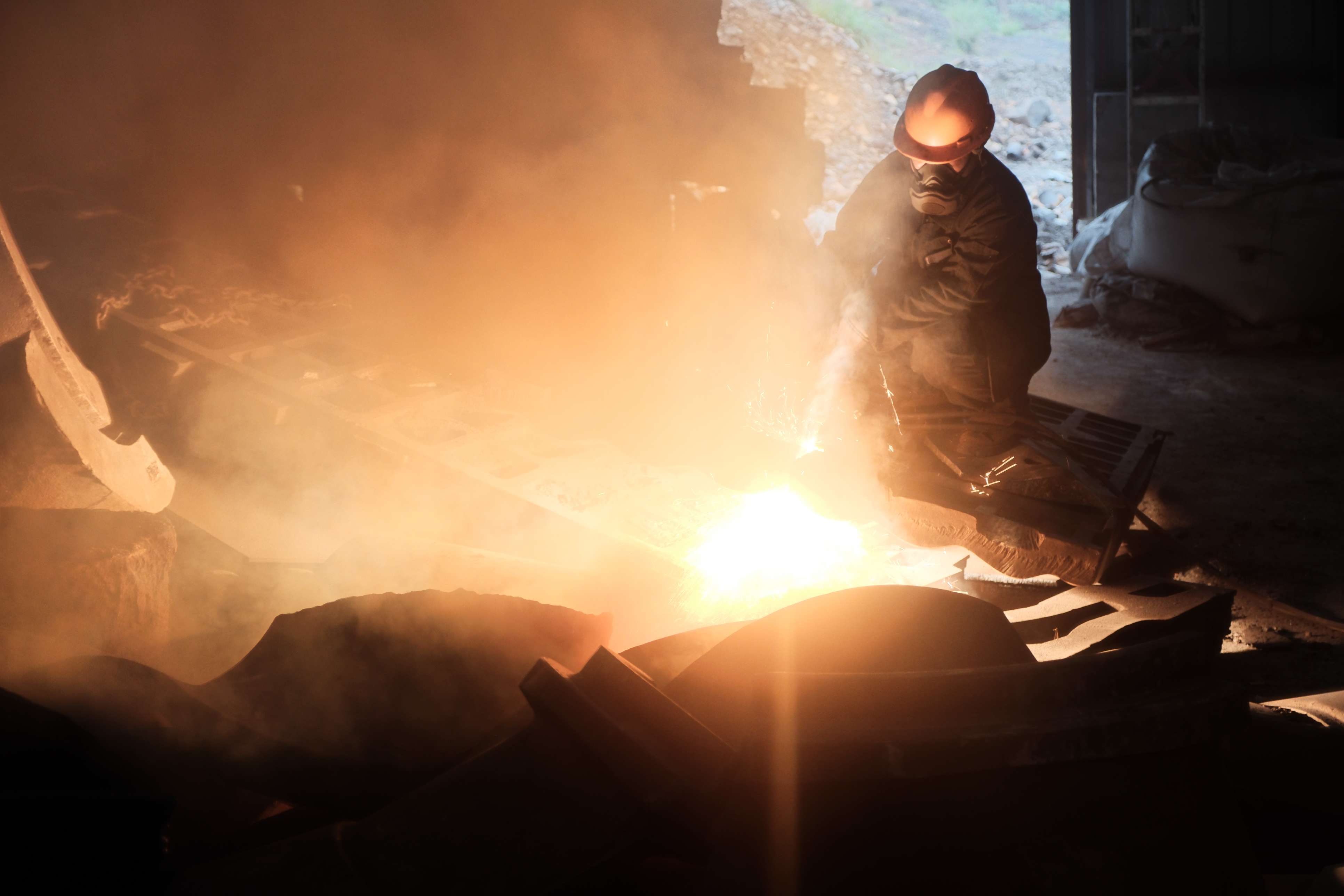 worker in crusher part factory